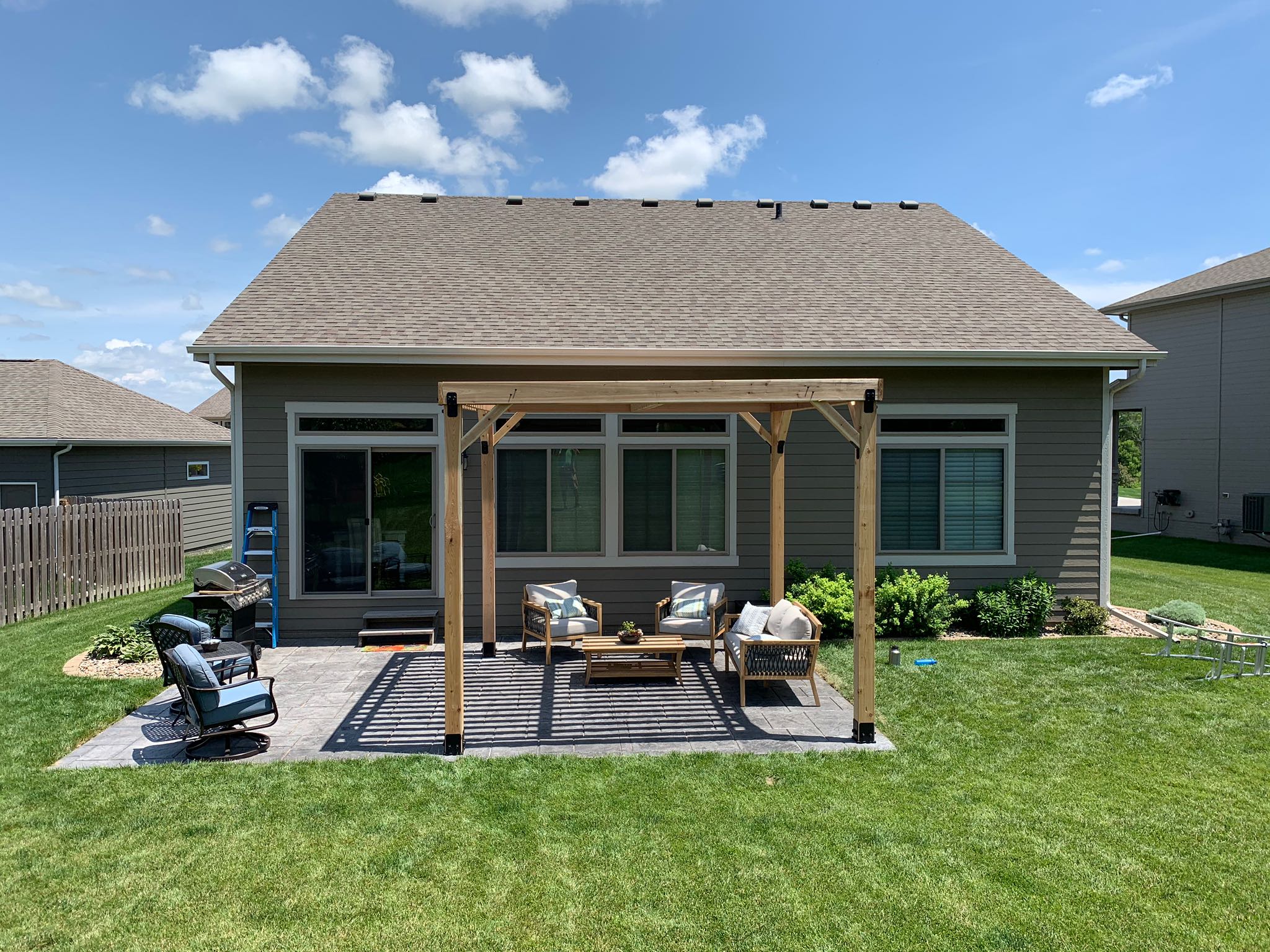 Backyard patio with pergola and seating
