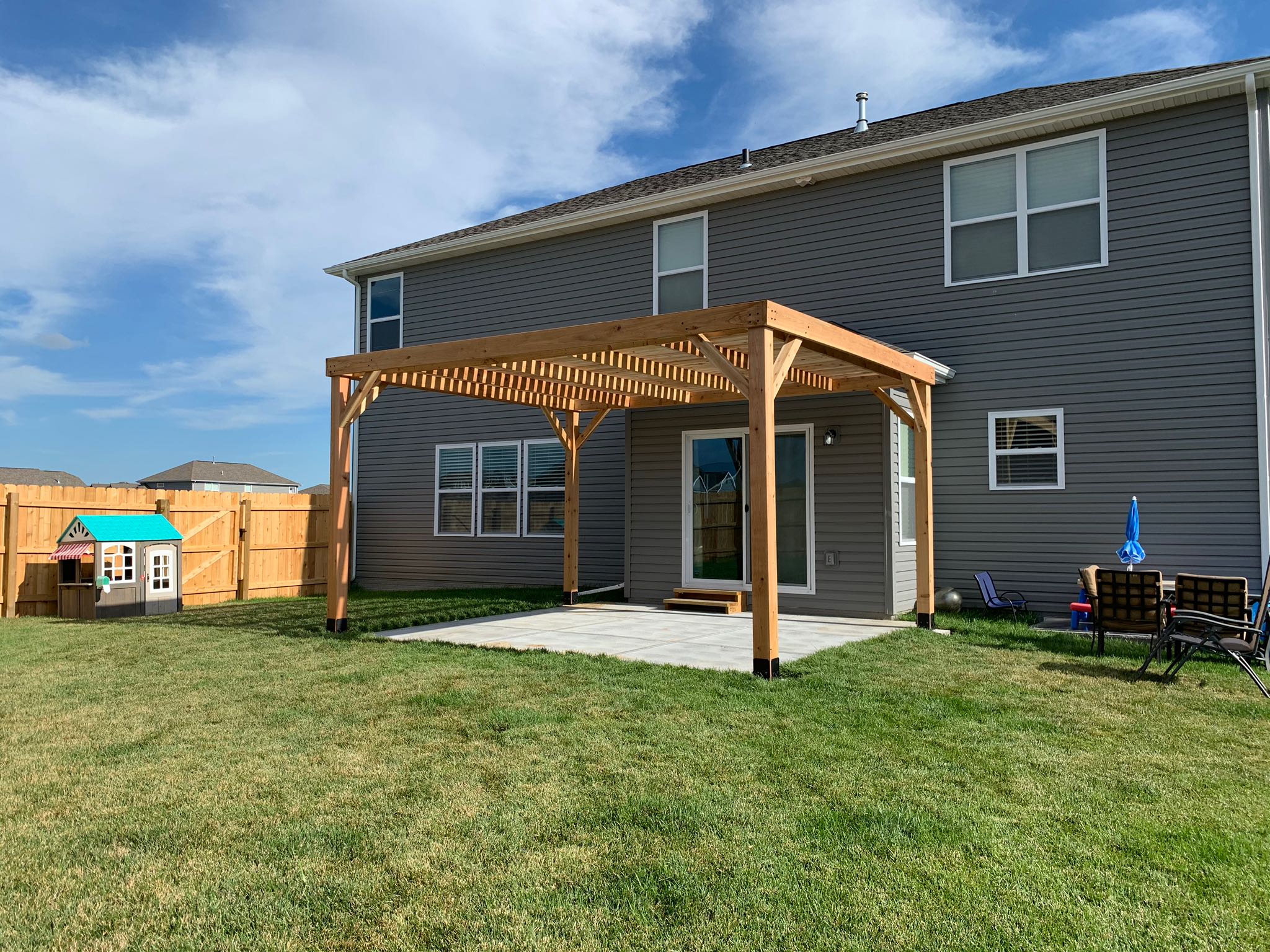 Wooden pergola in backyard