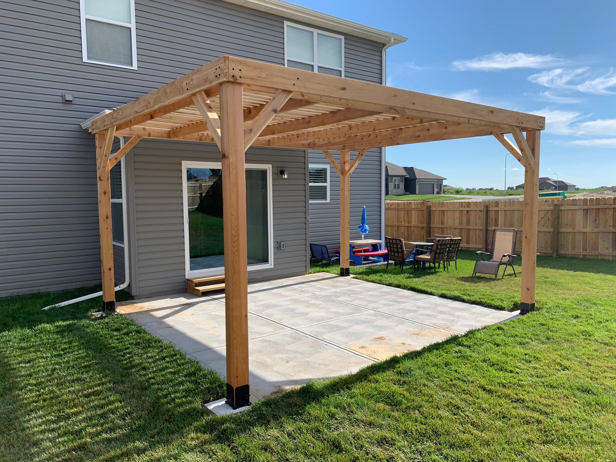 Outdoor patio with wooden pergola